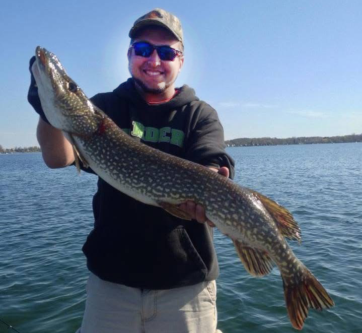 Eddie Bosas Jr. holding a monster-sized pike