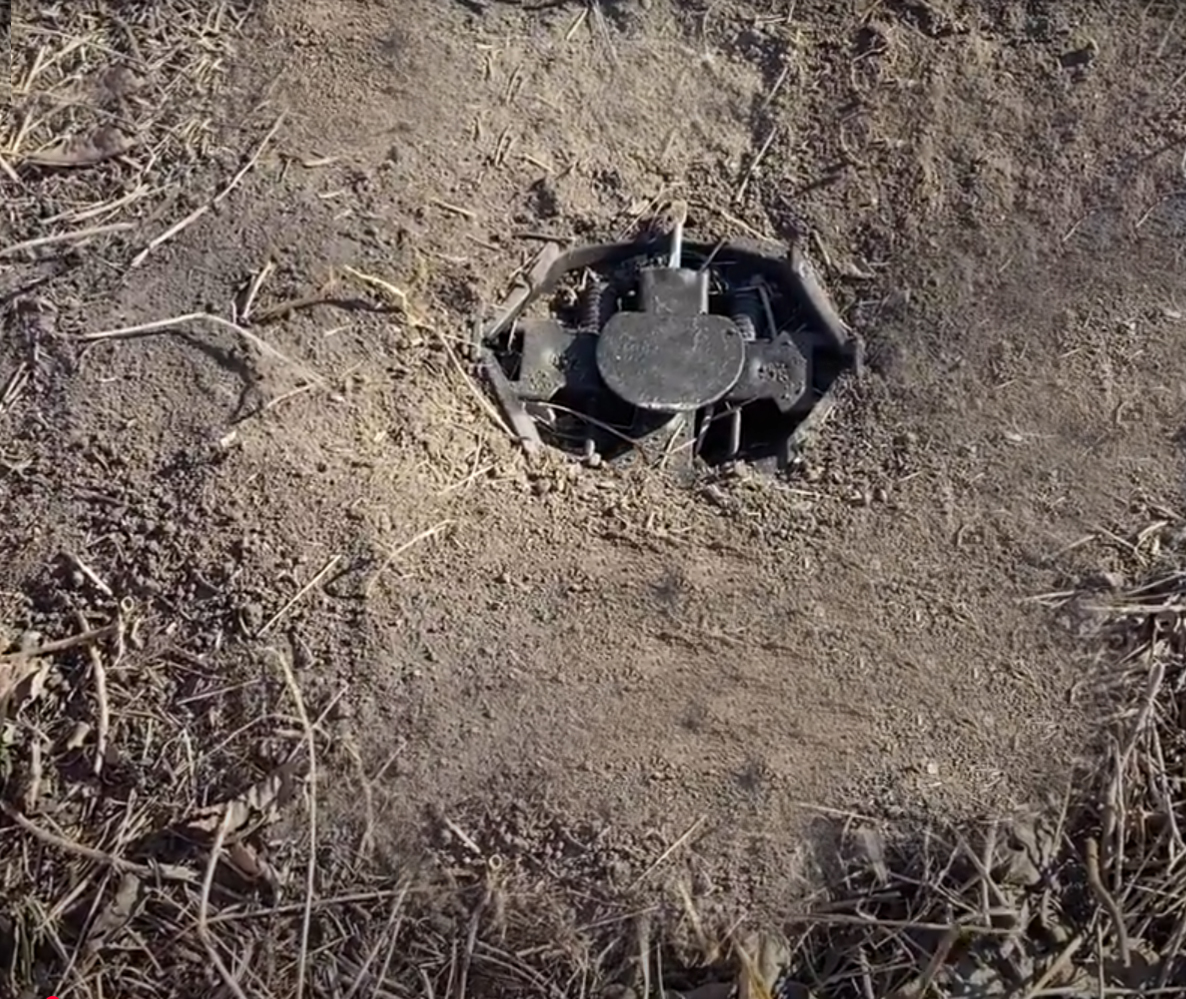 A perfectly bedded trap in the ground that will not rock or tip